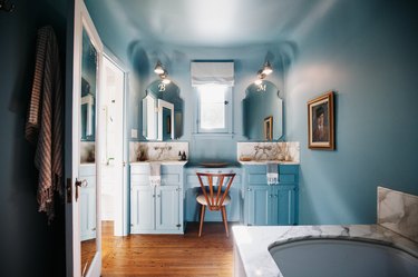 Light blue calming colors in bathroom with marble countertops.