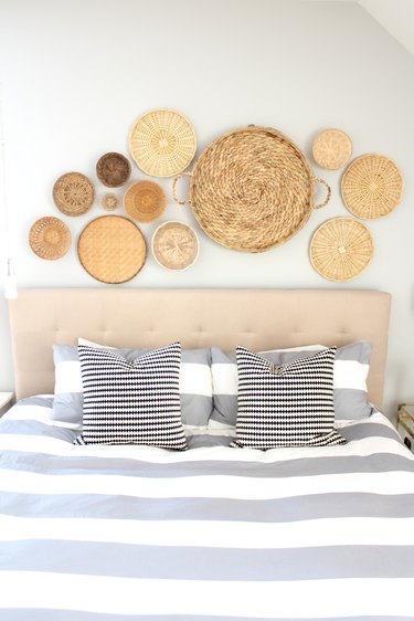 basket decor, baskets above bed, basket wall decor