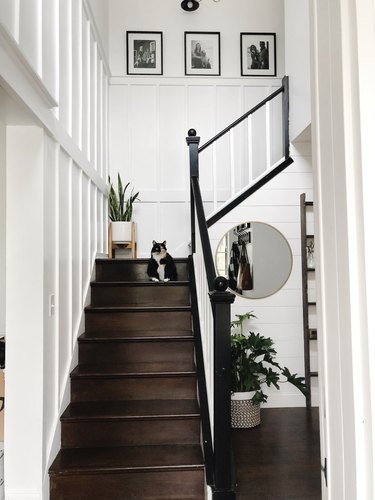 Wood stairs with white board and batten wall panels