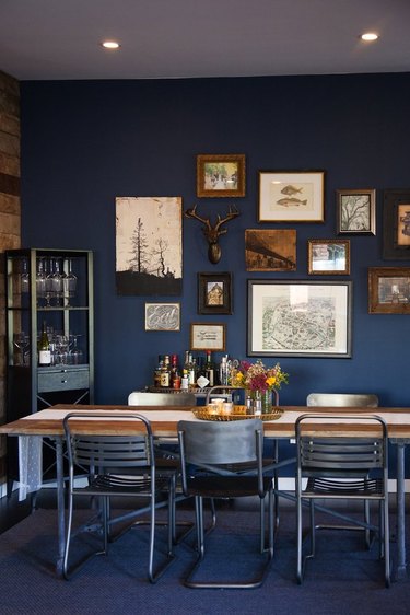 Rustic blue dining room with gallery wall