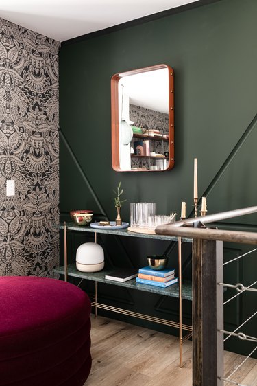 colors that go with green, burgundy ottoman next to green wall with green console table