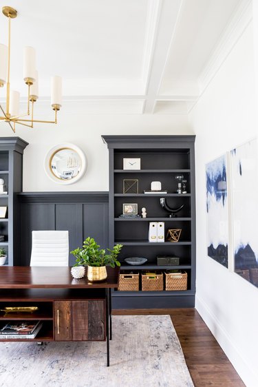 white home office with charcoal color built-in bookshelves