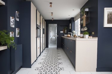 Kitchen floor tile idea with navy blue cabinets