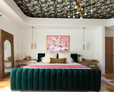 maximalist bedroom with jewel-tones and wallpaper on ceiling