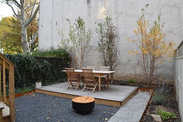 Simple plantings and natural surfaces are modern farmhouse characteristics.