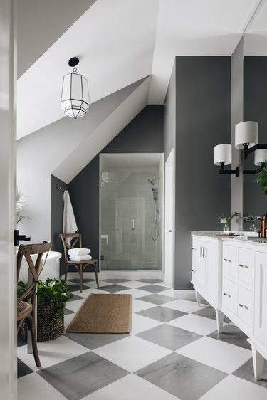 bathroom with charcoal color on walls and floor tile