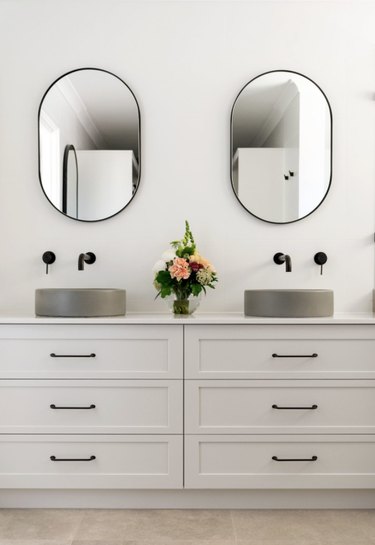 Gray concrete sink idea with gray vanity cabinet and black fixtures