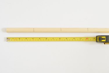 Wooden dowel and tape measure