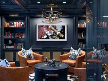 dark blue rustic man cave ideas with cigar photo and leather chairs