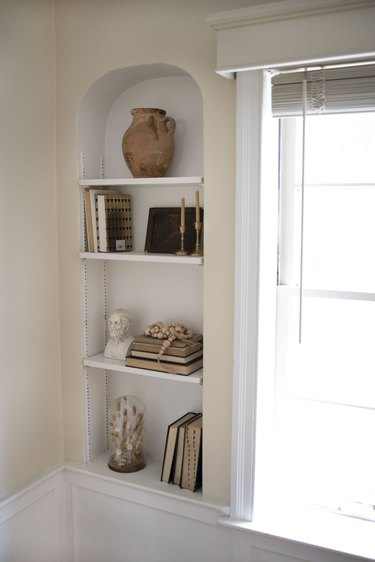 Styled shelf next to a bay window