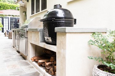 rustic outdoor kitchen with chopped wood and concrete countertop