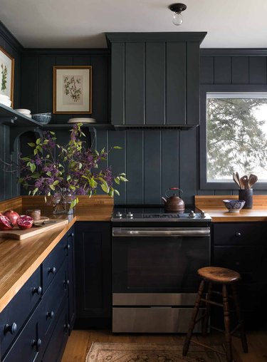 dark painted kitchen colors in kitchen with butcher block counter