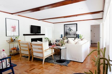 Natural light spills into the wood beamed living room.