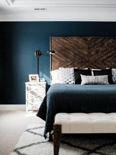 DIY rustic headboard in blue bedroom