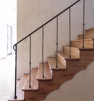 wood steps and riser with thin black stair railing