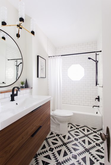 Modern bathroom featuring black and white accents