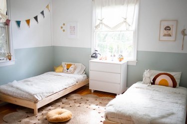 kids' bedroom with two-tone wall paint