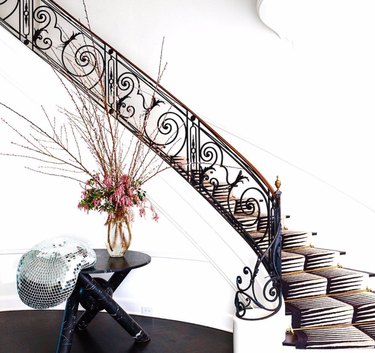 ornate black stair railing for maximalist staircase