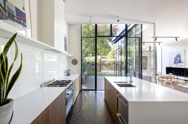 white contemporary kitchen with floor to ceiling windows