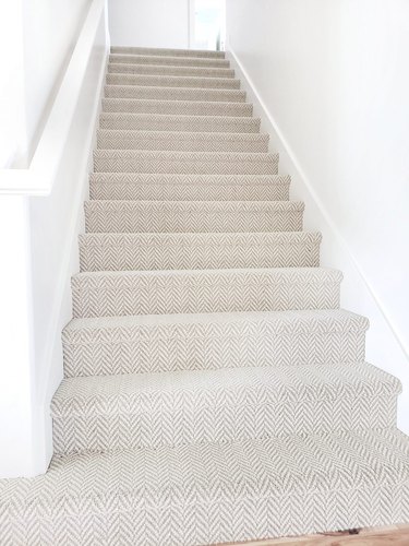 neutral stair carpet idea with houndstooth pattern in white staircase