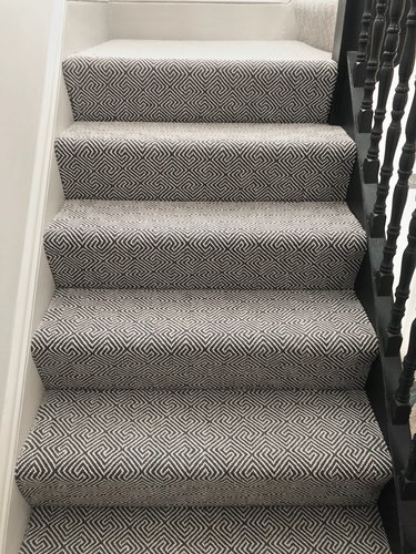 gray stair carpet idea with black railing