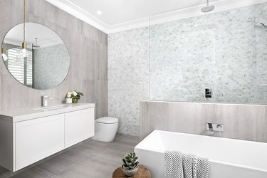 bathroom shower idea with a mosaic tile accent wall