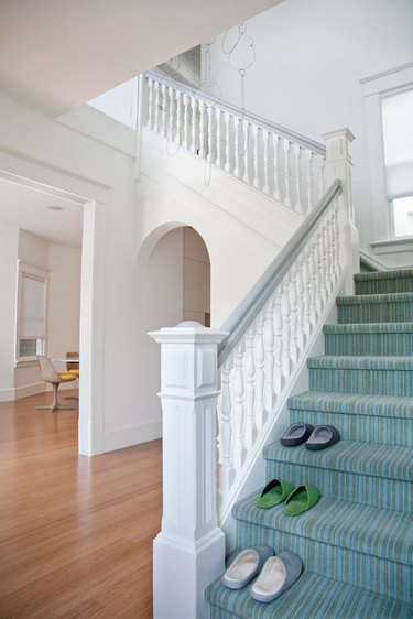 colorful striped stair carpet idea with white staircase