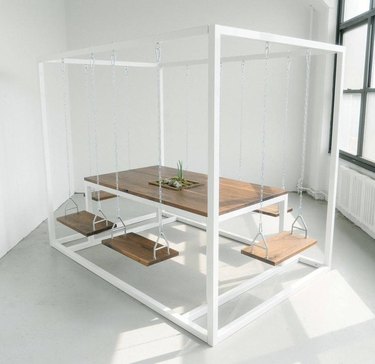 tall white swing table with swing chairs