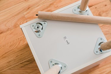 Screw in the 17-inch ash end table legs.