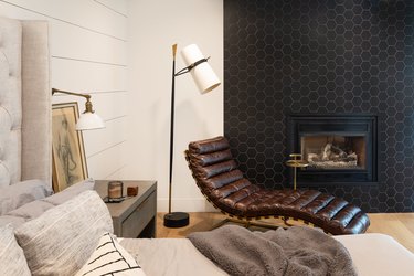 Cozy bedroom with black fireplace