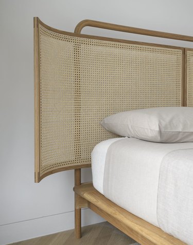 Bed with natural cane headboard
