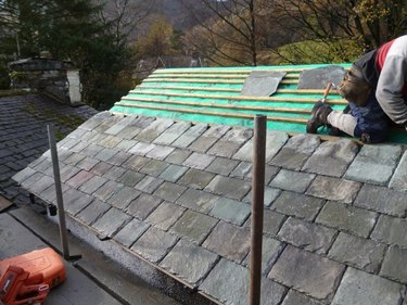 Installing a slate roof in the British countryside