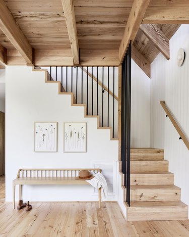modern rustic stair railing with natural wood stairs and white walls
