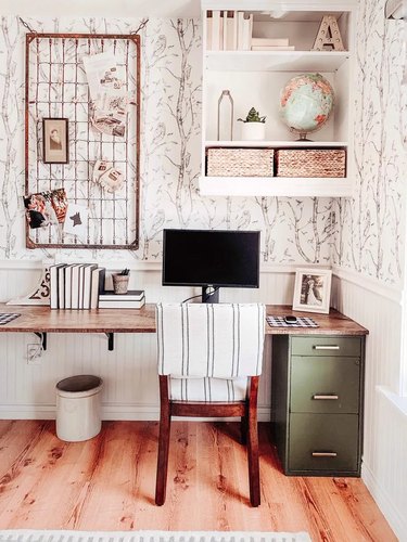 Rustic office with black and white wallpaper and vintage finds