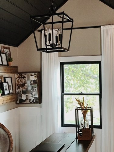 Rustic office with lantern pendant light and family photos
