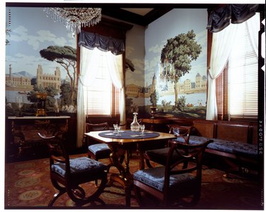 parlor room with natural landscape wallpaper