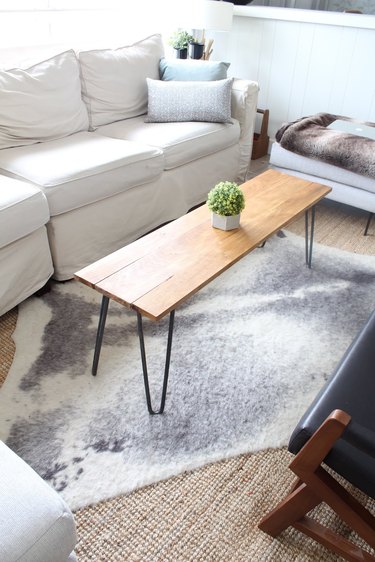 DIY rustic coffee table with hairpin legs and wood tabletop in modern living room