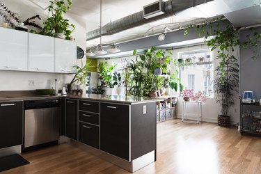 black and white kitchen, exposed ducting and hanging lights