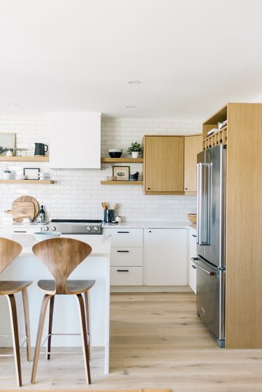 white cabinets in kitchen with wood accents