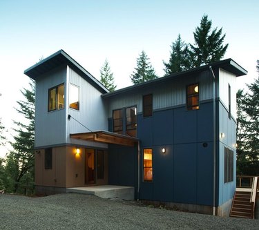 blue house with blue exterior window trime
