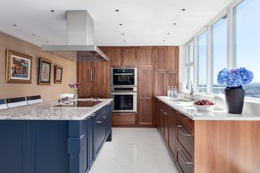 kitchen with wood cabinetry and blue island
