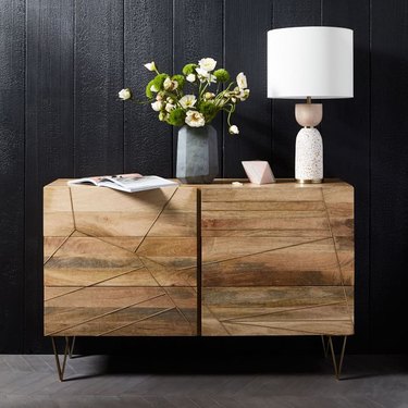 West Elm brass inlay dresser with six drawers and table lamp on top