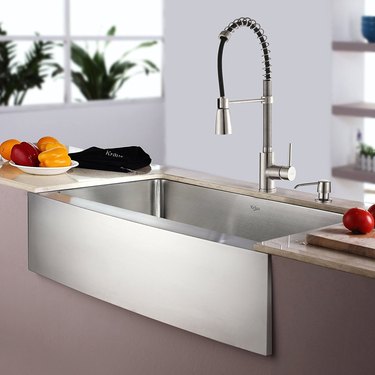 Stainless steel sink with apron