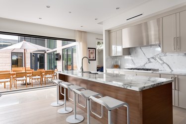 kitchen with off white cabinets and white island