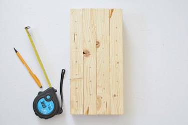 Pencil marks on bee house for drill holes