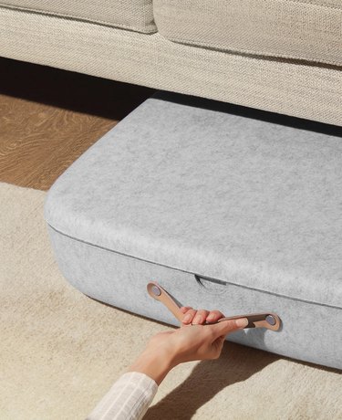 How to Organize Clothes with grey fabric clothes storage box underneath sofa