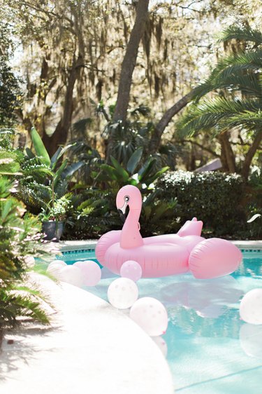 pink flamingo pool float in pool