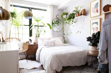 bedroom furniture ideas with greenery and shelving near woven accent chair