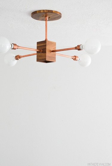 DIY home decor idea for your living room with copper and wood light fixture
