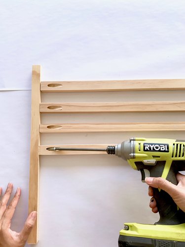 Wood dowels and drill for modern towel rack DIY